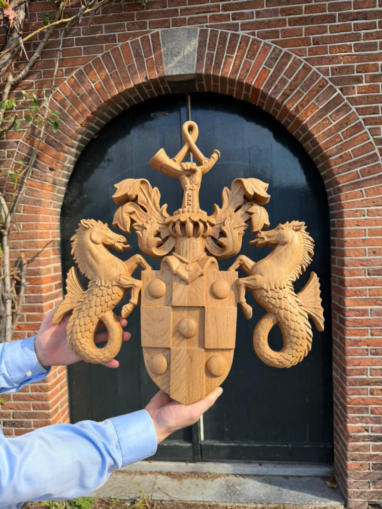 Wooden heraldic coat of arms with seahorse sculptures and shield design